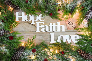 Christmas sign with Hope, Faith, Love and garland border