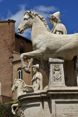 Castor and Pollux. Ancient marble statues of Dioskouri at the top of monumental balustrade in...