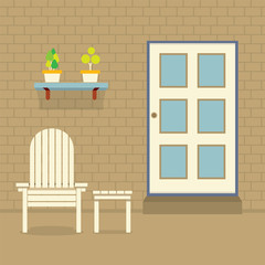 Garden Chair And Table With Pot Plants On Brick Wall