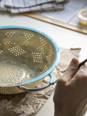 painting a recycled pot