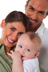 Portrait of happy mother and father with baby boy