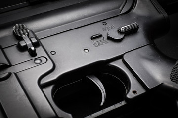 close-up safe mode of m4a1 assult rifle on black background