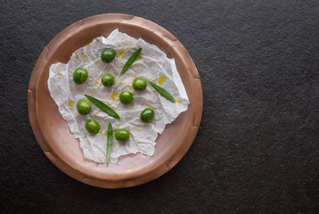 Raw olives in vintage plate