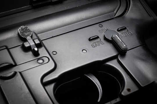 close-up semi mode of m4a1 assult rifle on black background