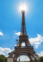 Fototapeta na wymiar Eiffel Tower. Sceme with spot of sun at the top. France, Paris.