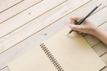 close up of hand write something on notebook