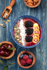 Bowl smoothie with berries and fruits. top view