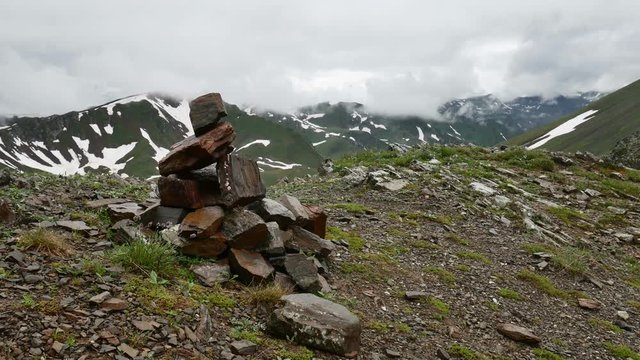 Piles of stones Mark of the right way in High Snowy mountains