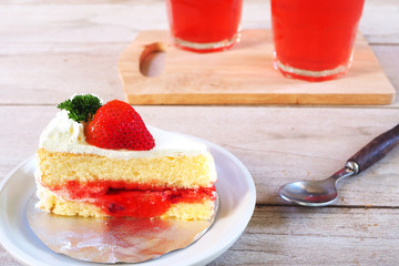 Close up of Strawberry milk cake on a white plate.