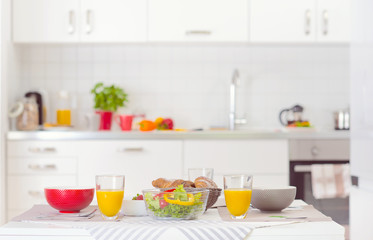 Fototapeta na wymiar Halthy breakfast on table in white kitchen