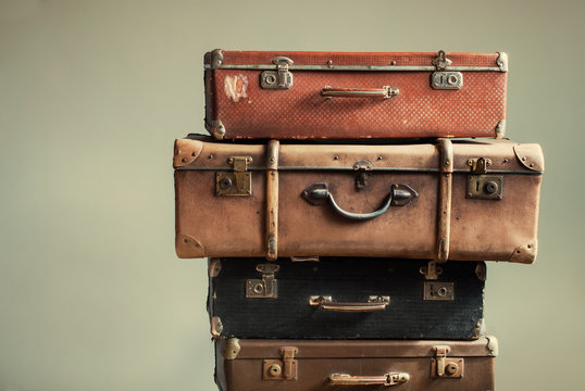 Vintage Ancient Suitcases Shabby Beige Background © olga pink
