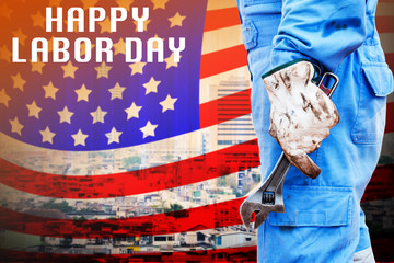 Labor Day concept with man holding wrench Amarica flag background