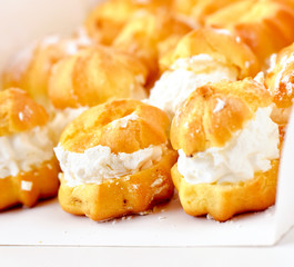 Cream puff cakes with whipped cream