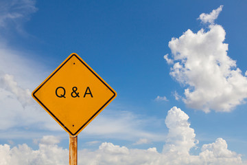 yellow road signpost with message "Q&A"