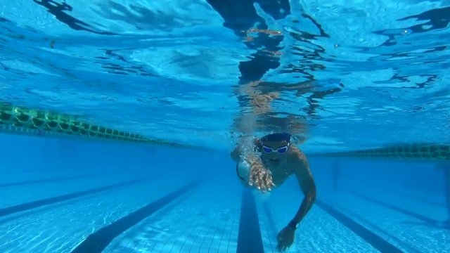 underwater view old man swimmer in pool