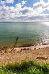 stony beach, sea and island.