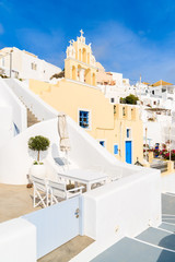 Fototapeta premium Typical street in Firostefani village with church building, Santorini island, Greece