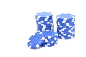 Blue poker chips isolated on white