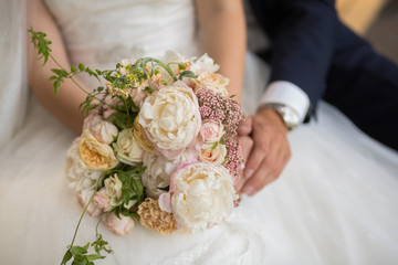 beautiful wedding bouquet in the hands of the bride