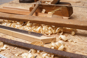 carpenter working,hammer,meter and screw-driver on construction