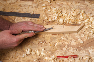 Carpenter working. Carpenter tools on wooden table with sawdust.