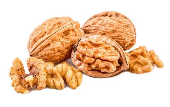 nuts or walnuts whole and shelled on white background