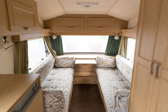 Inside of a caravn showing the seating area