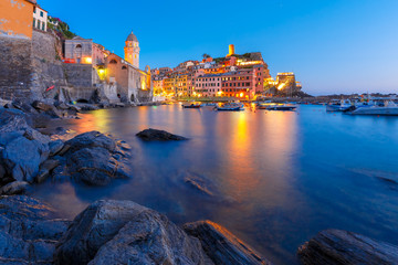 Night fishing village Vernazza with Santa Margherita di Antiochia Church and lookout tower of Doria Castle, Five lands, Cinque Terre National Park, Liguria, Italy.