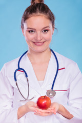 Happy dietitian nutritionist with apple fruit.