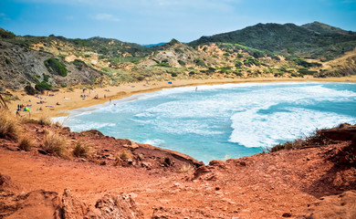 Red rocks on Playa de Cavalleria, Menorca