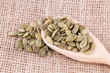 shelled pumpkin seeds isolated on white background