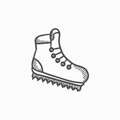 Hiking boot with crampons sketch icon.