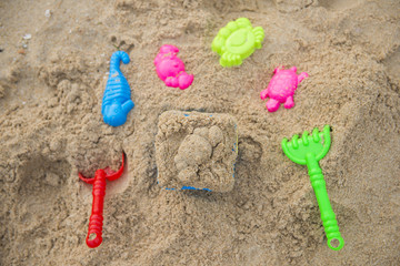 colorful toys for kids on sand