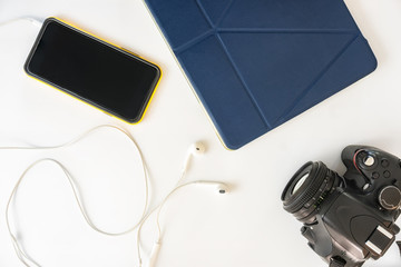 Fototapeta premium travel accessories on table with camera to be packed . traveling