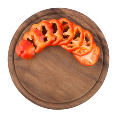 Sliced bell pepper on old cutting board.