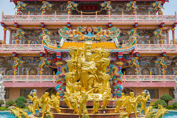 Golden statue of Naja god in Najasataisue Chinese Shrine located