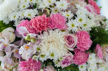 bunch of pink and white fresh variety flower and beautiful roses for lovely couple in valentine day or wedding day, Close up in all background , select focus