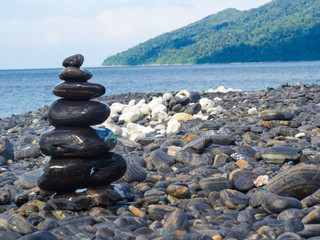 Black stones Lipe beach mountain background