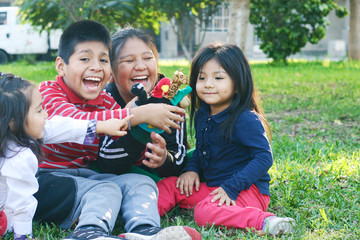Latin children playing with animal puppets