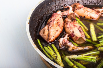 Fried squid with chives.