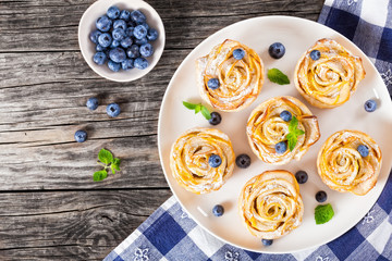 apple rose cake or cupcake and blueberry, top view