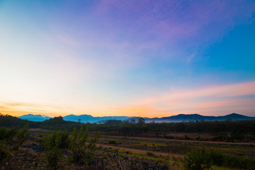 View of misty fog mountains in sunrise time