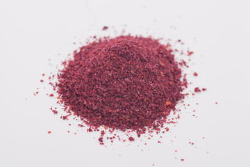 Sumac spice on white background