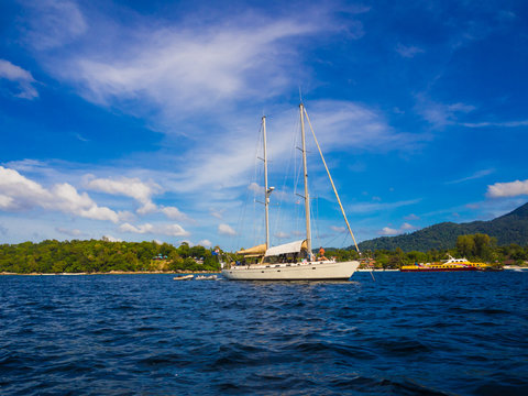 Luxury yachts sailing in blue ocean at Andaman sea