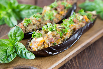 baked eggplant stuffed with vegetables, meat and cheese