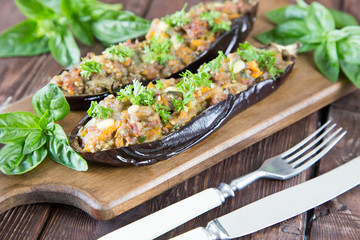 baked eggplant stuffed with vegetables, meat and cheese