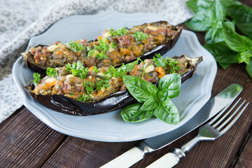 baked eggplant stuffed with vegetables, meat and cheese