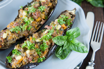 baked eggplant stuffed with vegetables, meat and cheese