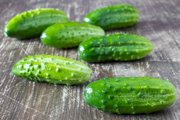 Cucumbers on a wooden background.