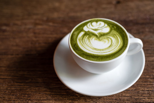 matcha green tea latte on a wooden table